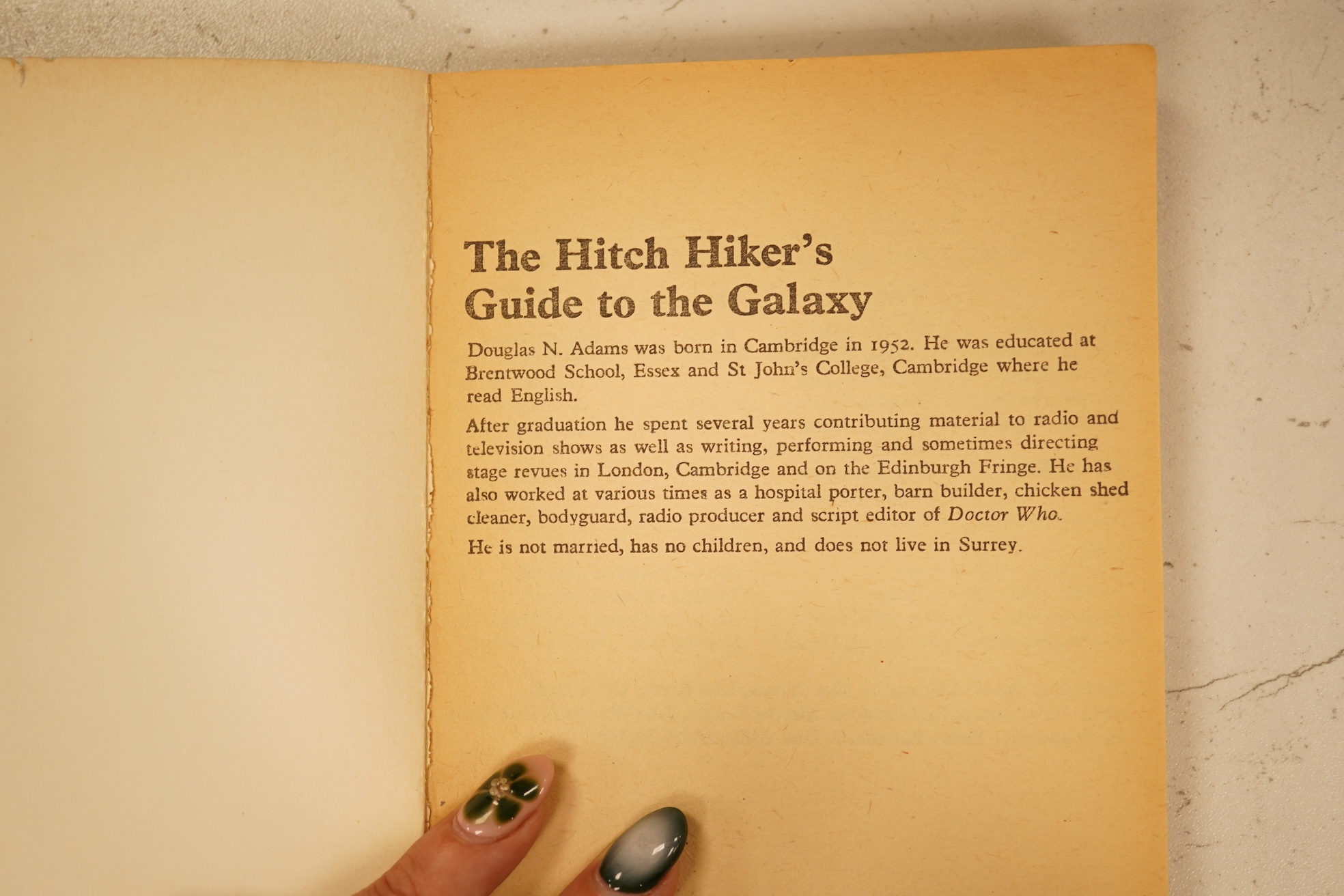 Adams, Douglas - The Hitch Hiker's Guide to the Galaxy. first edition, 2nd printing. half title/radio series leaf; paperback, sm. 8vo. Pan Books, 1979. *published same year as first and with a differently designed cover;